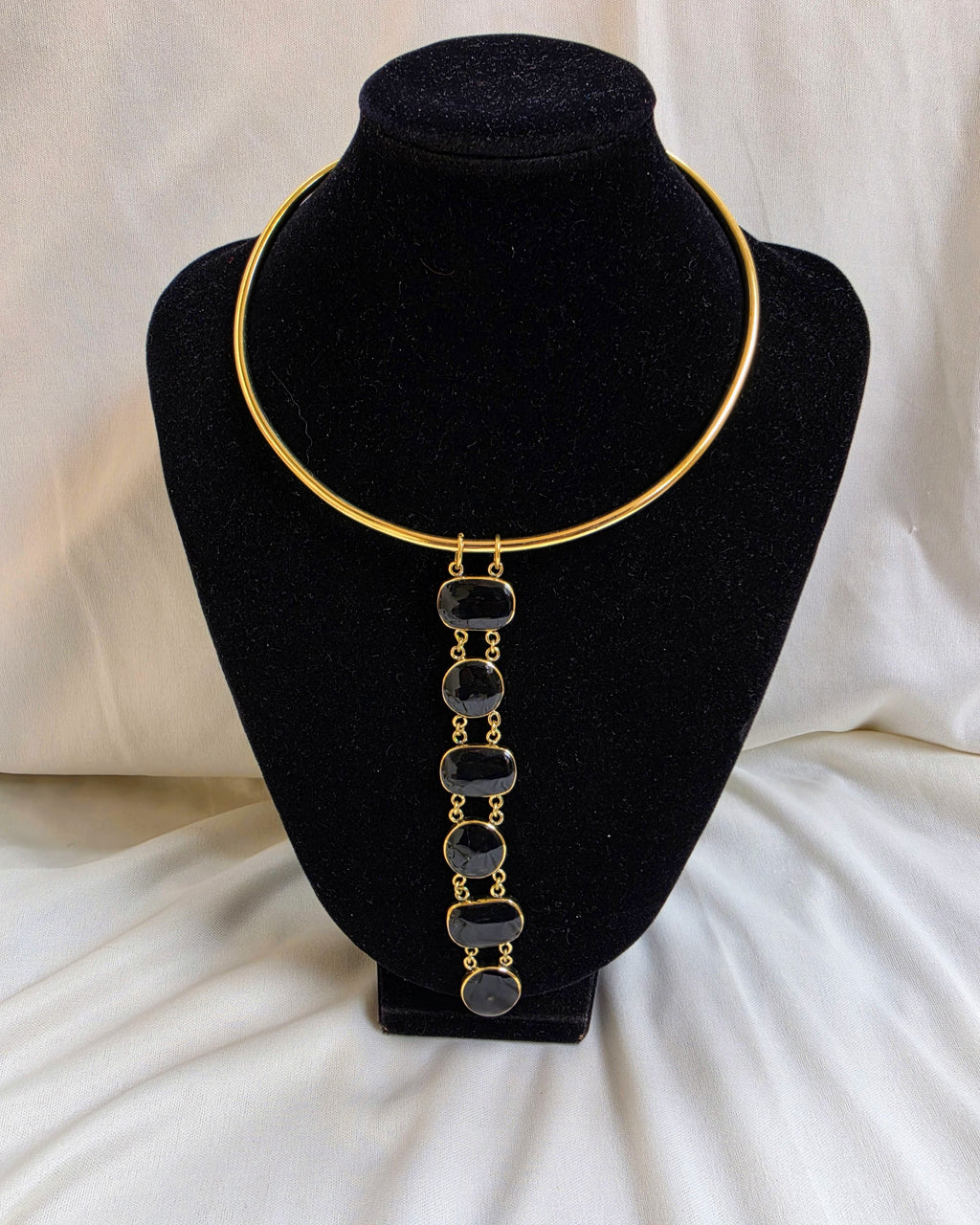 Asha Necklace - black stone bezel drop necklace on gold torque collar, product shot