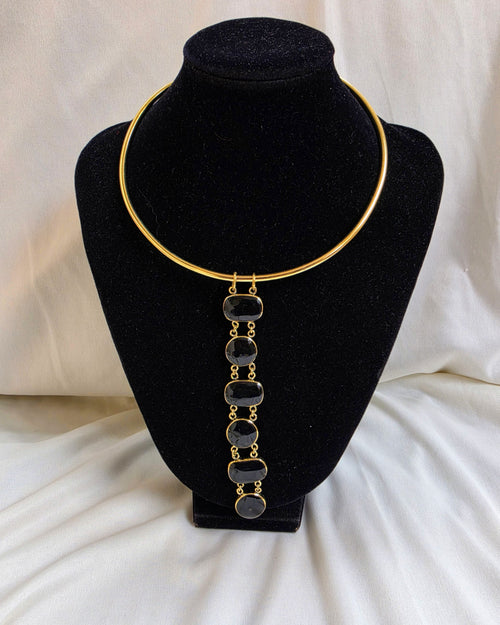 Asha Necklace - black stone bezel drop necklace on gold torque collar, product shot