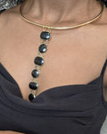 Asha Necklace - black stone bezel drop necklace on gold torque collar, worn