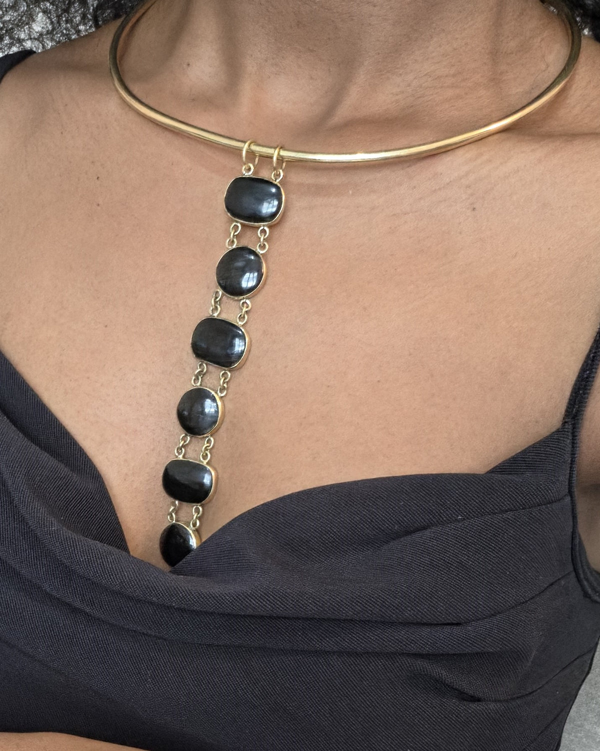 Asha Necklace - black stone bezel drop necklace on gold torque collar, worn