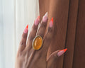 Vinje Ring - warm amber oval glass bead ring in gold bezel