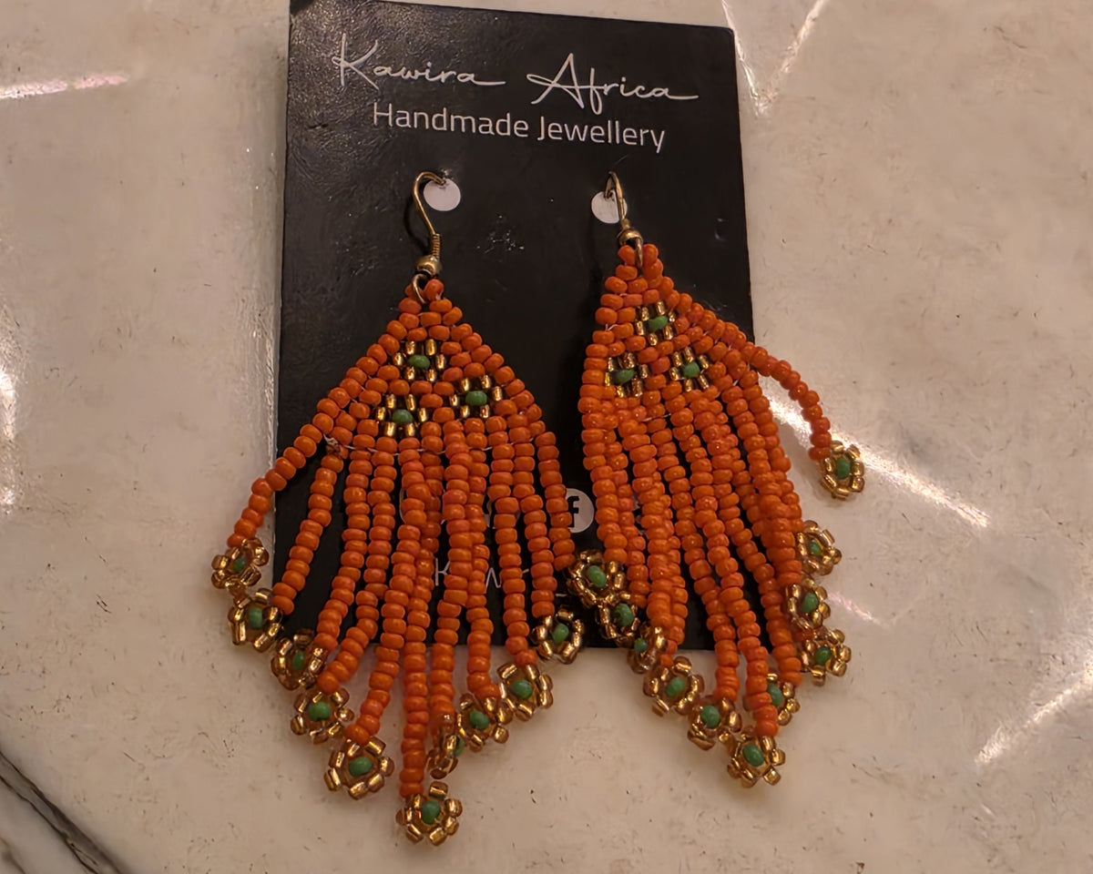 Kichanua orange fringe earrings with gold-toned flower details, green centres and gold-toned hooks