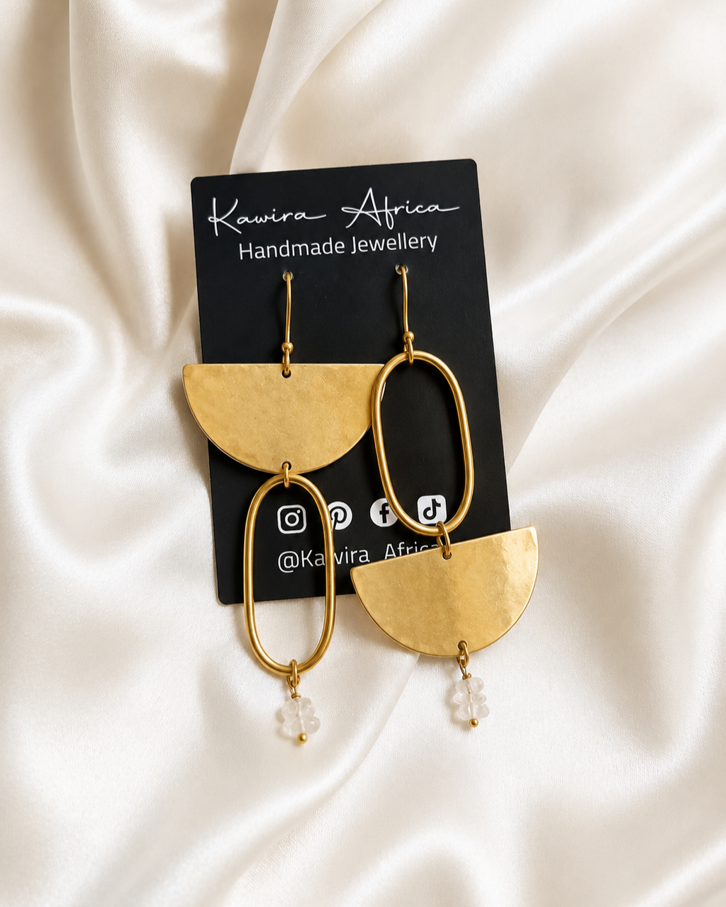 Zana Earrings on Kawira Africa jewellery card – asymmetric gold drop earrings