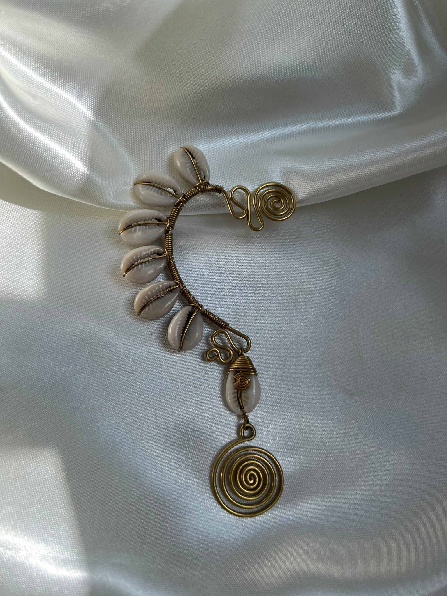 Watamu Ear Cuff - brass wire and cowrie shell left ear cuff with large spiral medallion drop, handmade in Kenya