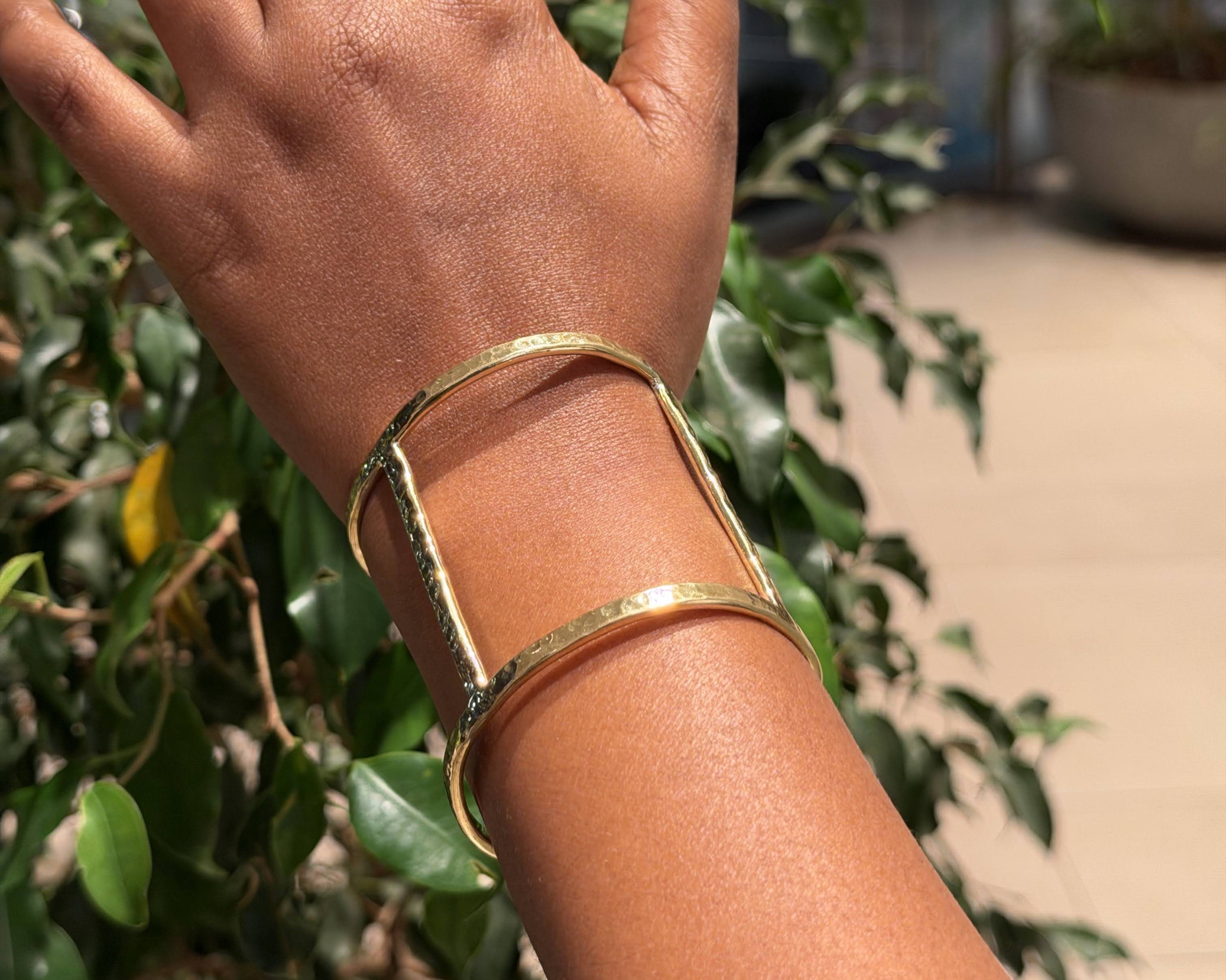 Ndare Bangle – hammered brass rectangular frame cuff worn on wrist, side view