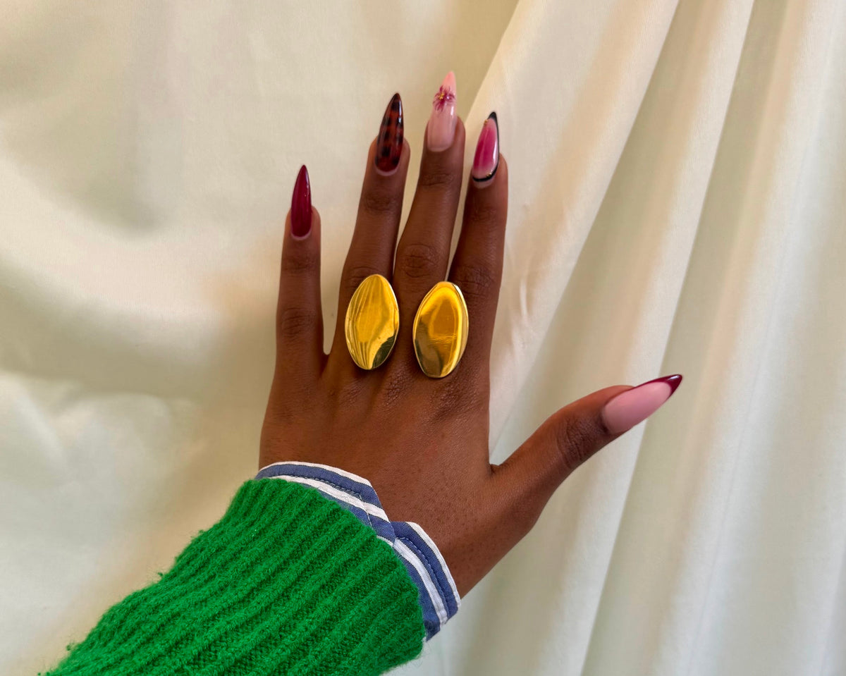 Tembo Tembo Ring - two polished gold oval dome rings worn together on hand