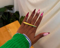 Moyo Ring - sleek polished gold bar ring worn on hand